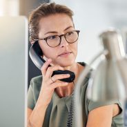 Telephone, phone call and business woman in office, talking and thinking. Landline, communication and female employee from Canada on call speaking, chatting or work discussion in company workplace.
